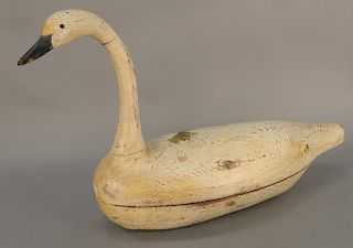 Large carved wood and white painted swan decoy, two piece body with glass eyes. 
height 22 1/2 in., length 36 in.