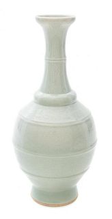 * A Monochrome Glazed Bottle Vase Height 10 inches.