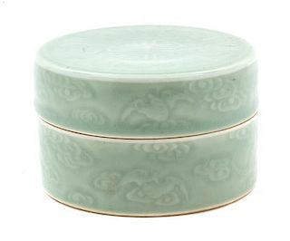 A Molded Celadon Glaze Porcelain Lidded Box Height 2 3/4 inches.