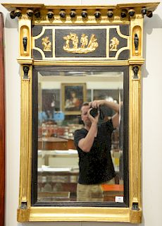 Federal gilt two part mirror having figures on frieze and Egyptian bust and figural capitals. 
42" x 30"