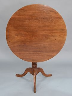 Mahogany tip table with ring turned shaft. 
height 27 3/4 in., width 34 1/4 in.