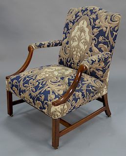 Chippendale mahogany upholstered armchair on squared legs with H stretcher, circa 1760. 
height 38 in., width 29 1/2 in.