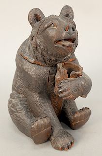 19th century carved black forest tobacco humidor bear, seated bear having glass eyes opening at hinged neck and holding a tree stump...