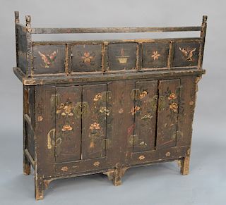 Chinese paint decorated cabinet with cribbed top over four doors, all in old paint. 
height 45 1/4 in., width 44 3/4 in.