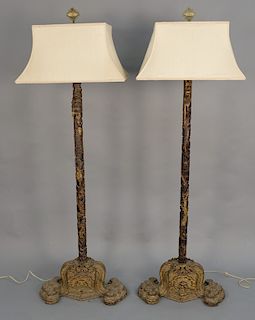 Pair of carved Chinese floor lamps having a carved dragon shaft and carved shaped base. 
total height 72 in.

Being sold to benefit ...