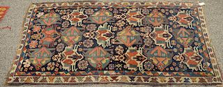 Caucasian Oriental throw rug (side and end wear). 
3'2" x 6'