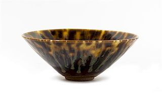* A Brown Glazed Stoneware Tea Bowl Diameter 6 1/4 inches.