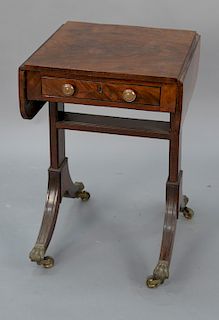 Mahogany Duncan Phyfe drop leaf table with one drawer having brass paw feet, circa 1830. 
height 27 1/4 in., top closed: 17" x 18", ...