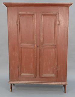 Primitive cupboard with two doors having bootjack ends. 
height 74 in., case width 48 1/4 in., depth 15 in.