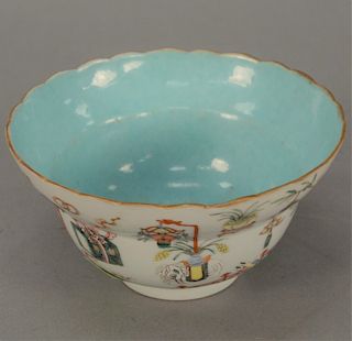 Chinese famille rose bowl, exterior painted with peach tree courtyard, flying bats, and antiques, seal mark on bottom. 
height 3 in....