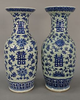 Pair of large Chinese baluster vases, celadon glazed with blue and white scrolling vines and flowers (all handles off). 
height 24 1...