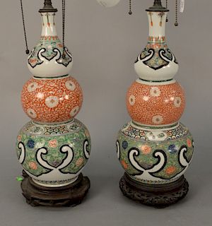Pair of Chinese famille verte triple gourd porcelain vases having painted scrolling vines, flowers, and butterflies, made into table...