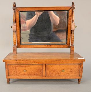 Birdseye maple shaving mirror with two drawers, early 19th century. 
height 22 in., width 20 3/4 in.