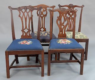 Four Chippendale mahogany side chairs having pierce carved backs, one with over upholstered seat and three with slip seats, all 18th...