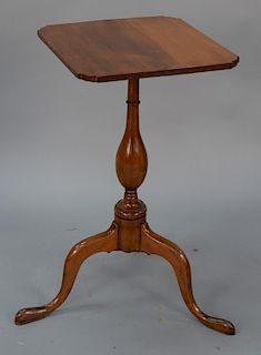 Federal cherry candle stand with shaped top on turned shaft ending in tripod base. 
height 26 in., top: 14 1/4" x 15"