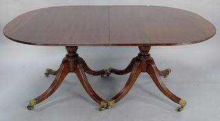 George IV mahogany two part dining table with two 24 inch leaves. 
height 28 1/4 in., closed: 48 1/2" x 67", open: 48 1/2" x 115"