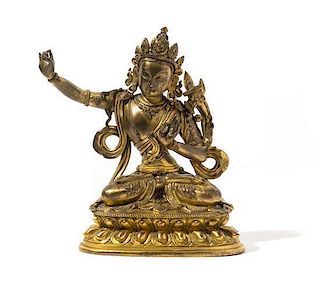 A Sino-Tibetan Gilt Bronze Figure of a Buddhist Deity Height 6 3/4 inches.