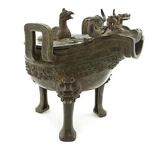 A Warring States Style Cast Bronze Zoomorphic Lidded Censer Height 8 3/8 inches.