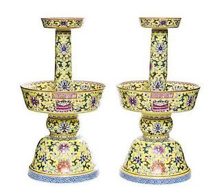 A Pair of Famille Jaune Porcelain Candlesticks Height 10 1/2 inches (each).