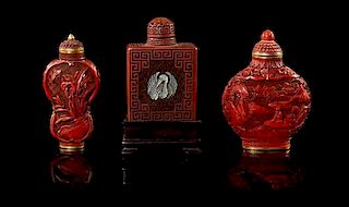 * Three Cinnabar Lacquer Snuff Bottles Height of tallest 3 1/8 inches (with stand).