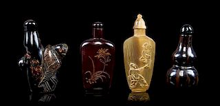 A Group of Four Snuff Bottles Height overall of first 2 7/8 inches.