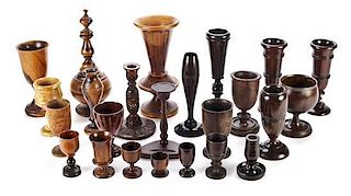 A Collection of Twenty-Five Treenware Vases, Egg Cups and Candlesticks, Height of tallest 12 inches.