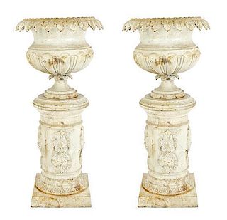 A Pair of Monumental White-Painted Cast Iron Jardinieres on Stands, Height 60 x width 19 inches.
