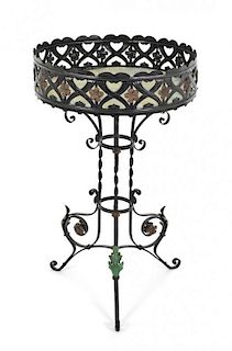 A Spanish Baroque Style Painted Metal Jardiniere Stand, Height 34 1/2 x diameter 20 3/4 inches.