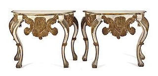 A Pair of Hispano-Portuguese Baroque Style Painted and Parcel Gilt Carved Wood Console Tables, Height 35 x width 47 x depth 18 1