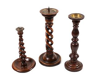 Group of Three Twisted Wood Candlesticks Height of tallest 15 inches