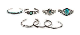 Seven Southwestern Silver Bracelets Length of largest 5 3/4 x opening 2 1/2 x width 1 1/4 inches