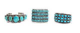 Three Southwestern Silver and Turquoise Cuff Bracelets Length of first 5 3/4 x opening 1 1/8 x width 1 7/8 inches