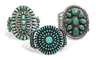 Three Southwestern Silver and Turquoise Cluster Bracelets Length of one 5 3/4 x opening 1 1/4 x width 3 inches