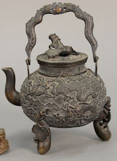Chinese bronze dragon pot with handle.
