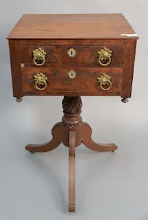 Federal mahogany two drawer stand on carved pedestal set on three downswept members, circa 1840