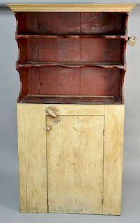 Primitive cupboard having cornice molding over two scalloped shelves over single door, interior with old red finish (exterior painted white). height 7