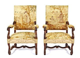 A Pair of Louis XIV Style Carved Fruitwood Arm Chairs, Height 44 1/2 x width 29 x depth 30 inches.