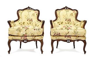 A Pair of Louis XV Style Bergeres, Height 36 1/4 x width 27 1/2 x depth 22 3/4 inches.