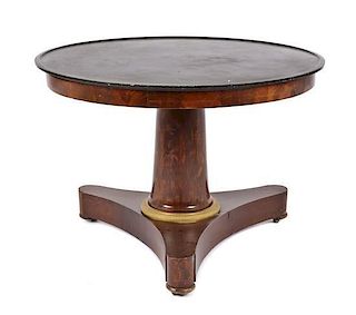 An Empire Style Mahogany Marble Top Center Table, Height 27 x diameter 39 1/4 inches.