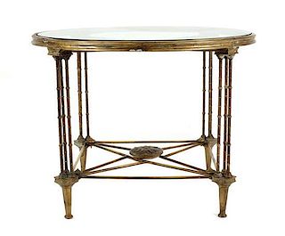 An Empire Style Bronze and Glass Center Table, Height 29 1/2 x diameter 39 inches.