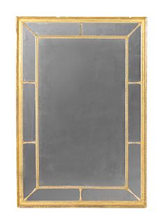 An Empire Giltwood Mirror Height 46 1/4 x width 31 1/2 inches.
