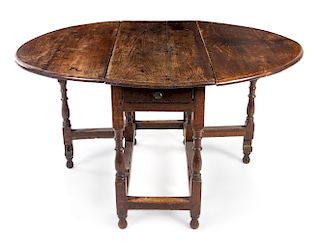 A William and Mary Oak Drop-Leaf Table Height 30 x width 42 1/4 x depth 18 3/4 inches (closed).