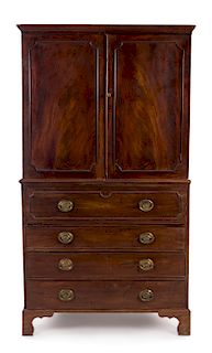 A George III Style Mahogany Linen Press Height 82 x width 45 x depth 23 inches.