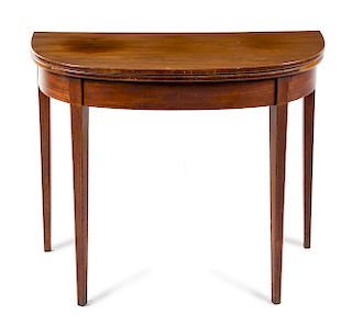 A Georgian Style Mahogany Flip-Top Game Table Height 29 x width 36 x depth 17 inches.
