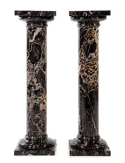 A Pair of Continental Marble Pedestals Height 42 inches.