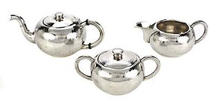 A South American Silver Three-Piece Small Tea Set, 20th Century, Height of teapot 3 inches.