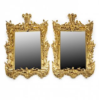 Pair of large historicist mirrors with frames in carved and Pareja de grandes espejos historicistas con marcos en mader