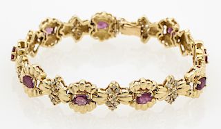 A 14kt yellow gold Ruby and Diamond link bracelet