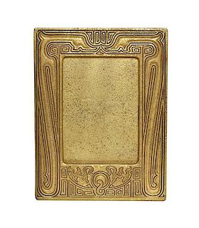 A Tiffany Studios Dore Bronze Picture Frame, Height 8 5/8 x width 6 3/4 inches.