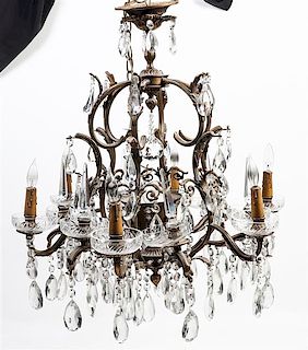 A Gilt Metal and Glass Six-Light Chandelier Height 29 1/2 x diameter 27 inches.